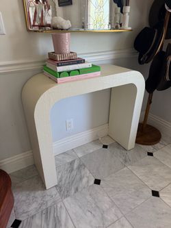 White curved side table from CB2