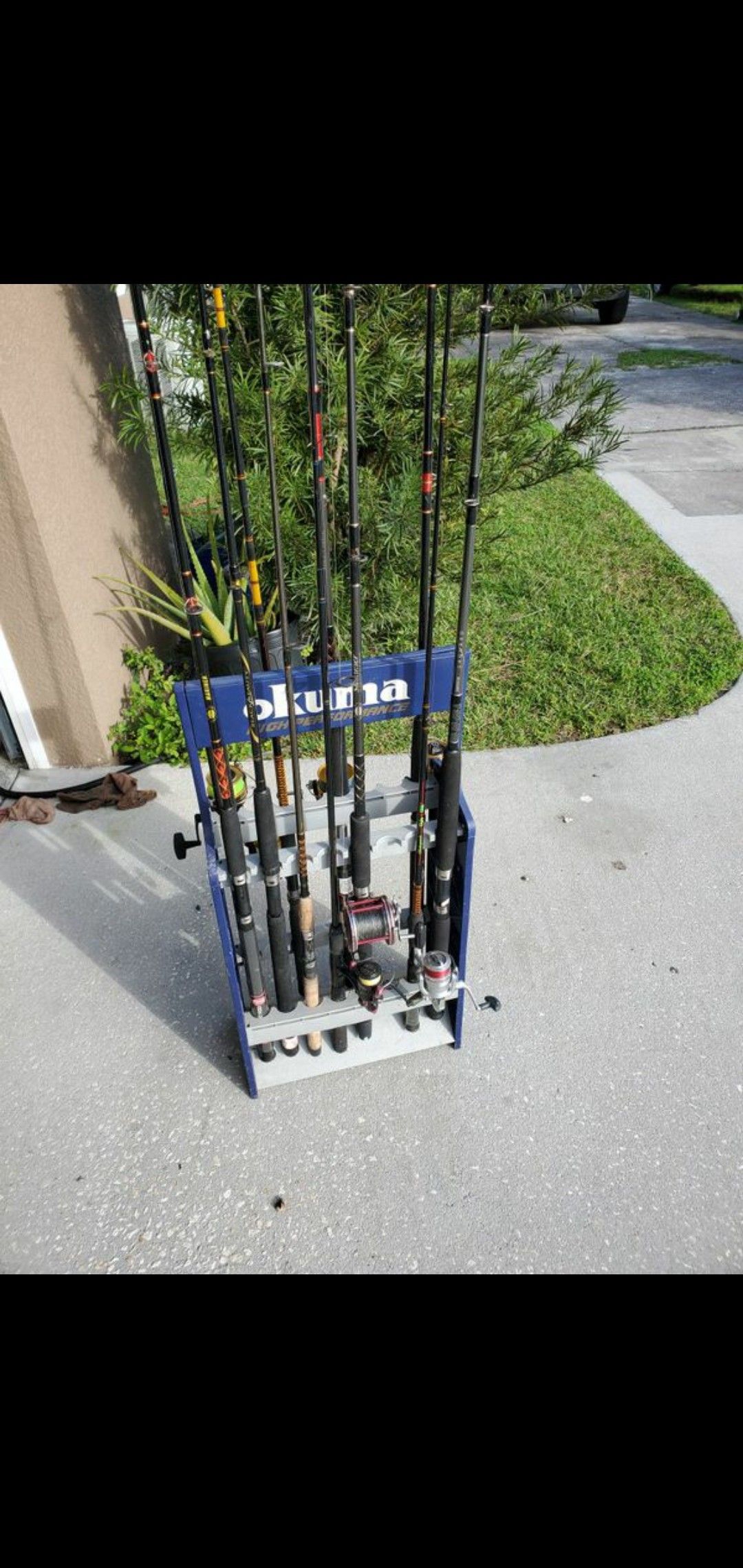 whole lot of fishing gear rod and reels