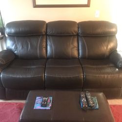 Leather couch and chair both reclining