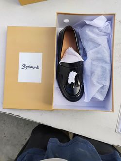 Black leather tassel loafers