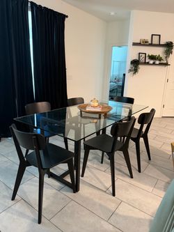 Glass Top Dining Table with 6 Black Chairs