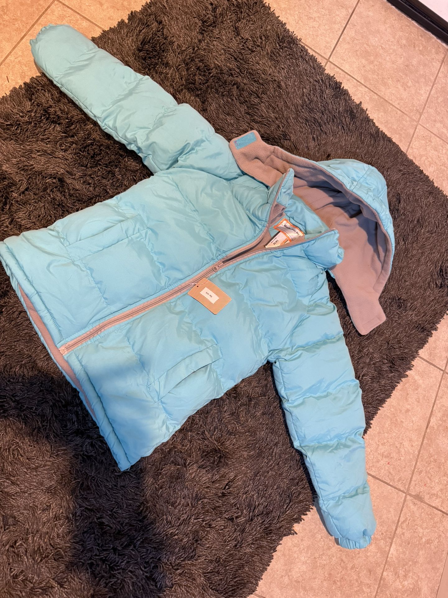 Brand New Turquoise Winter jacket Size 14/16  Inside is soft fleece