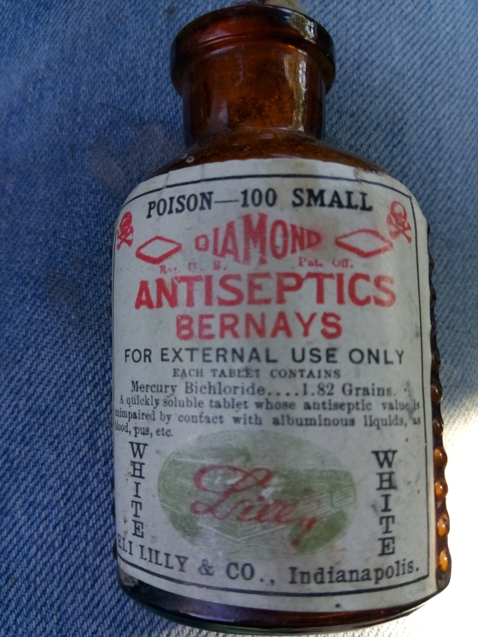 Antique bottle with coffin-shaped Mercury pills still in them it's full