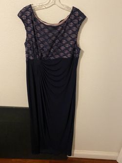 Dark Navy Blue Formal Gown with a beaded illusion top and draped skirt. Size 16.