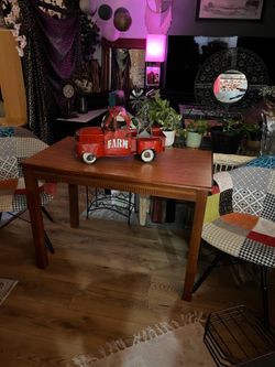Very cute table with three patchwork chairs