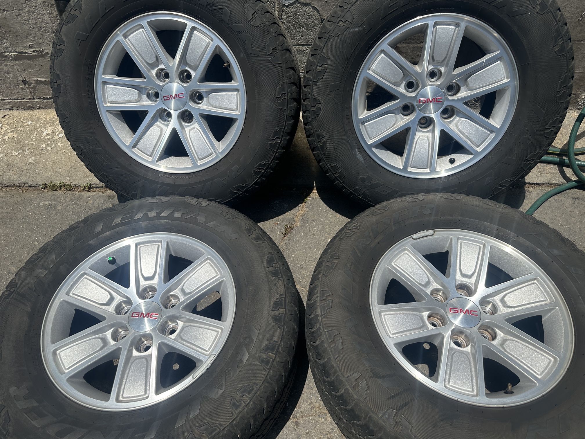 GMC Sierra stock 6 lug 17 inch rims with used tires. fits Chevy
