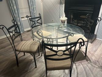 Glass table with four chairs