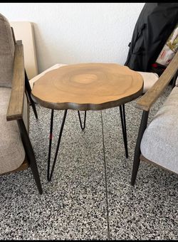2 gray chairs with wood table