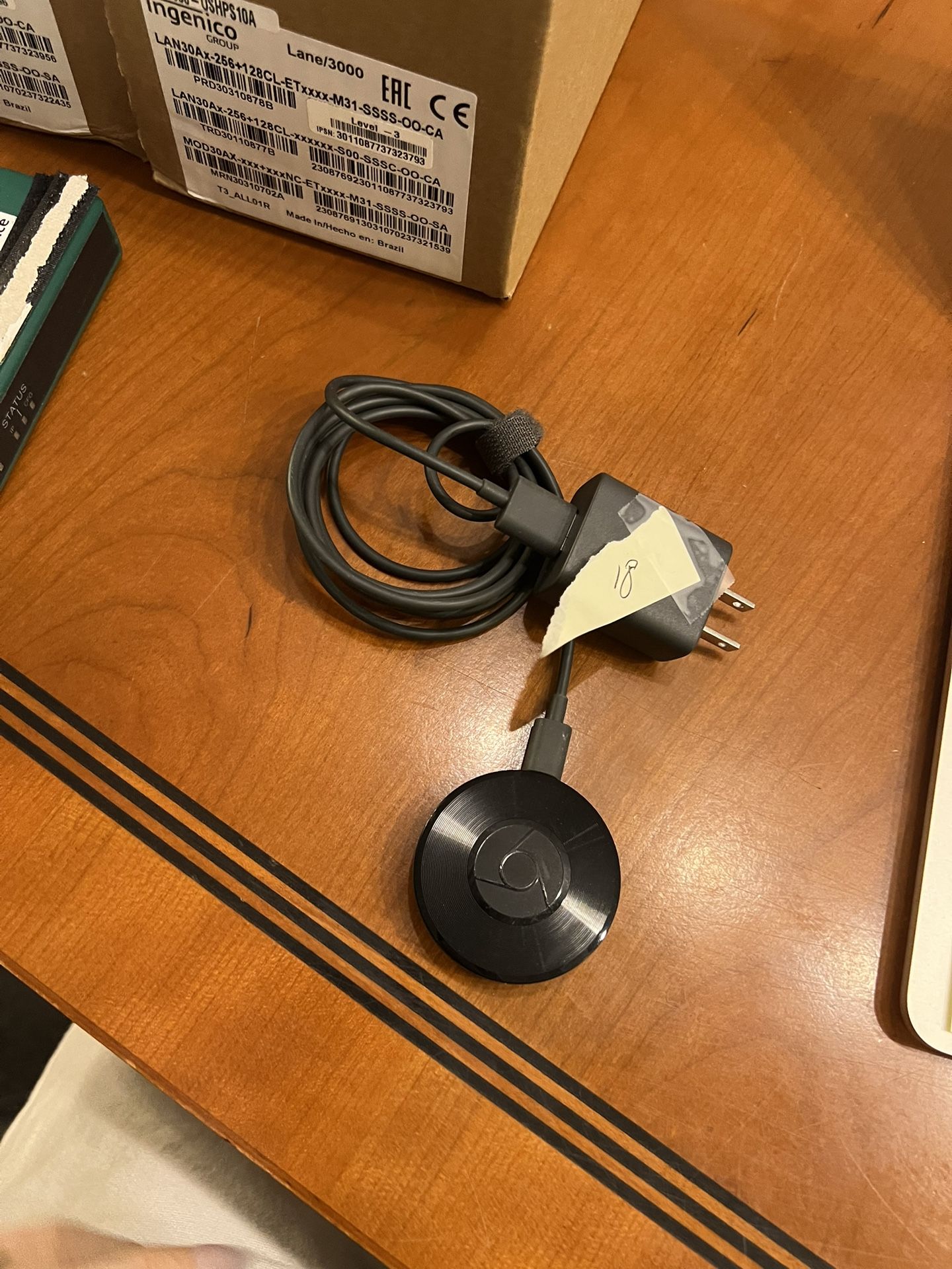 Google Chromecast streaming media player, specifically one of the earlier generations (likely 2nd or 3rd generation