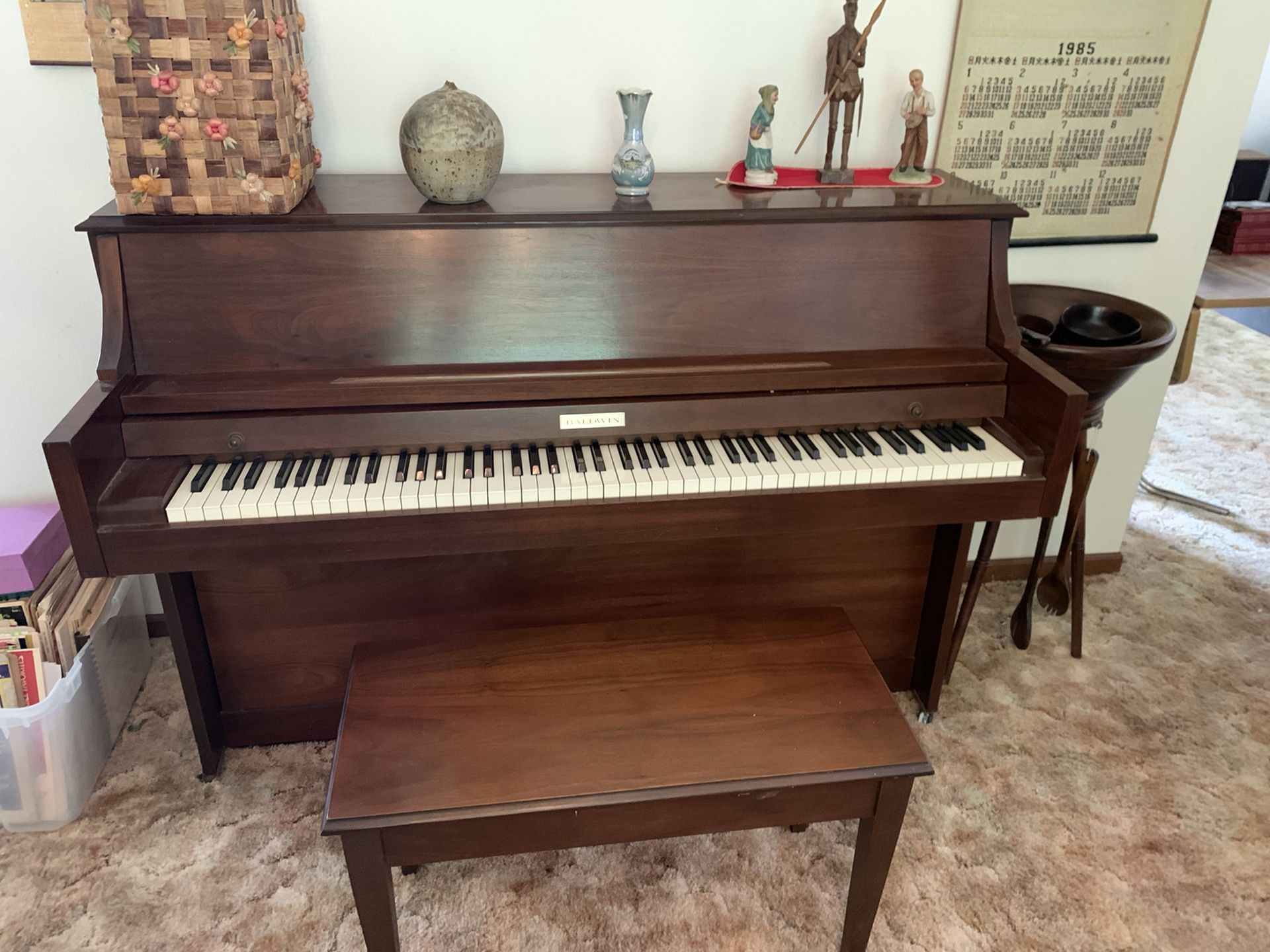 Free (must be picked up). Baldwin 806 Walnut Piano and Bench. All keys work. Great condition!