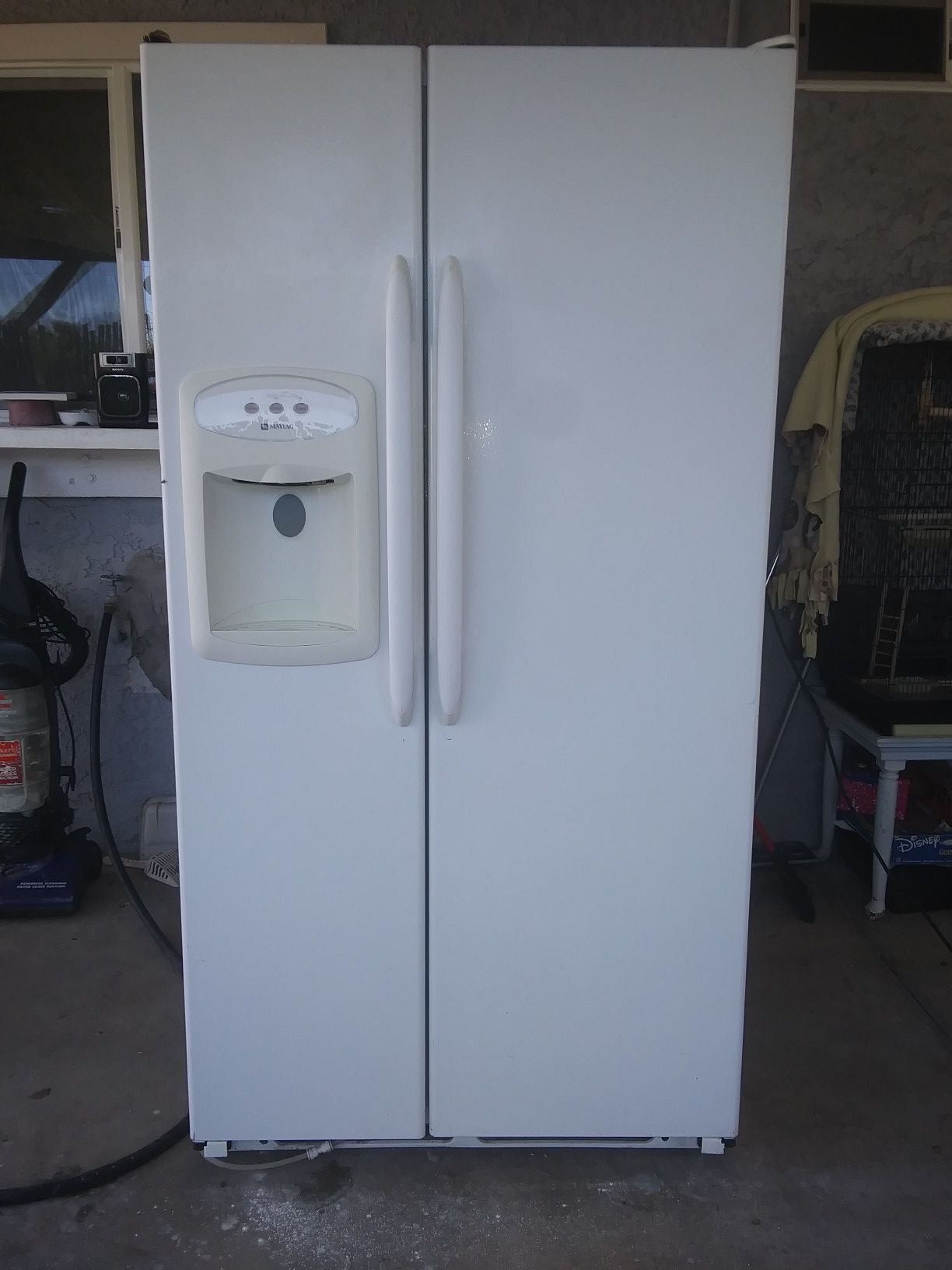 Maytag side-by-side refrigerator / freezer. WORKS LIKE NEW... VERY CLEAN! 26 total Cubic Feet of food storage space!