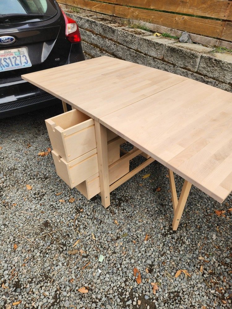 IKEA drop leaf fold down table w/ drawers NORDEN birch space saver tan

Great design fold down table for storage in small spaces 