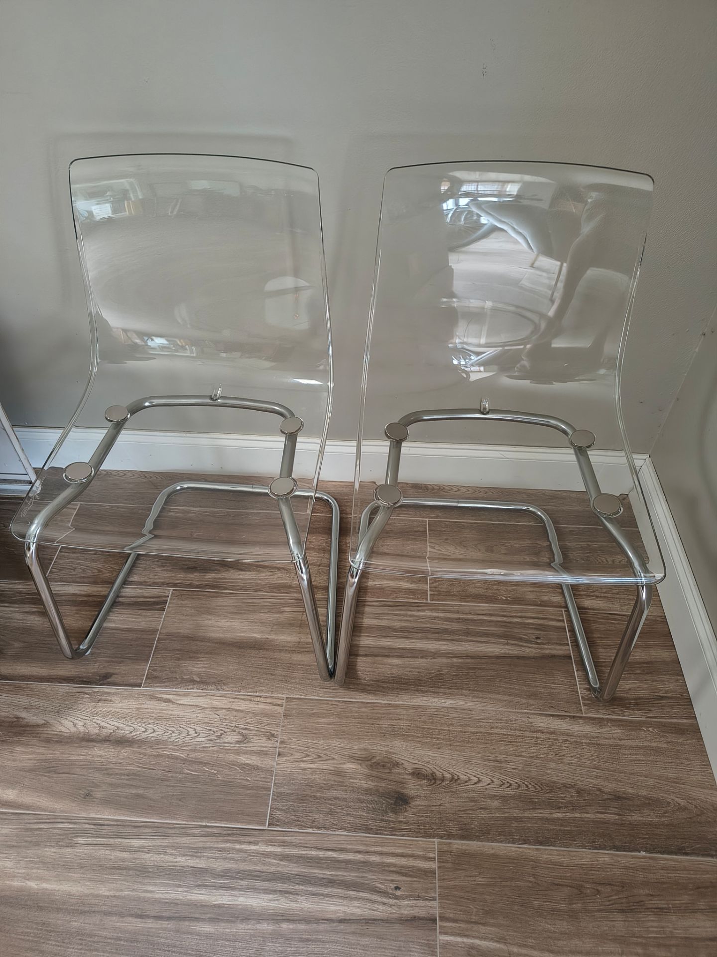 2 Clear and Chrome Ghost Chairs