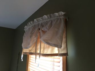 Curtains. I have 2 of these. For 10.00 each with bracket which is curved