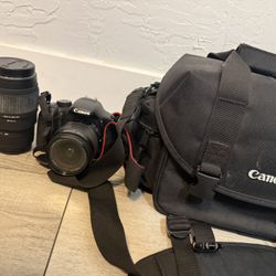 Canon EOS 550D (Rebel T2i) DSLR camera bundle. Includes the 18-55mm kit lens (perfect for everyday shooting) and a Sigma 70-300mm f/4-5.6 DG telephoto