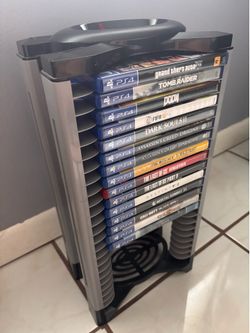 Video game storage stand/tower with 15 PS4 games (negotiable)