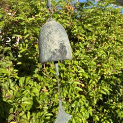 Beautiful sculptural hanging wind bell/wind chime featuring an aged green-gray verdigris-style patina and decorative fan-shaped wind catcher. Lightwei