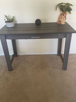 Small grey wood tone lightweight desk