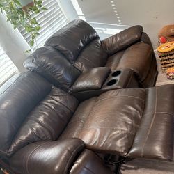 Dual recliner leather couches