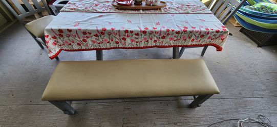grey dining room table with 4 chairs and bench