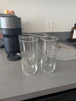 4 tall glasses washed once never used