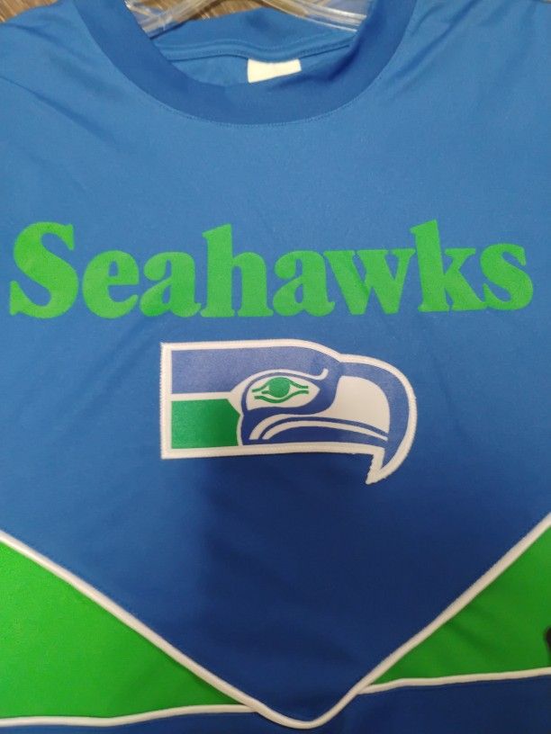 New With Tags....4 Seattle Seahawks Shirts... Yes They're Available
