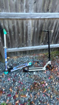 Two scooters one boy one girl