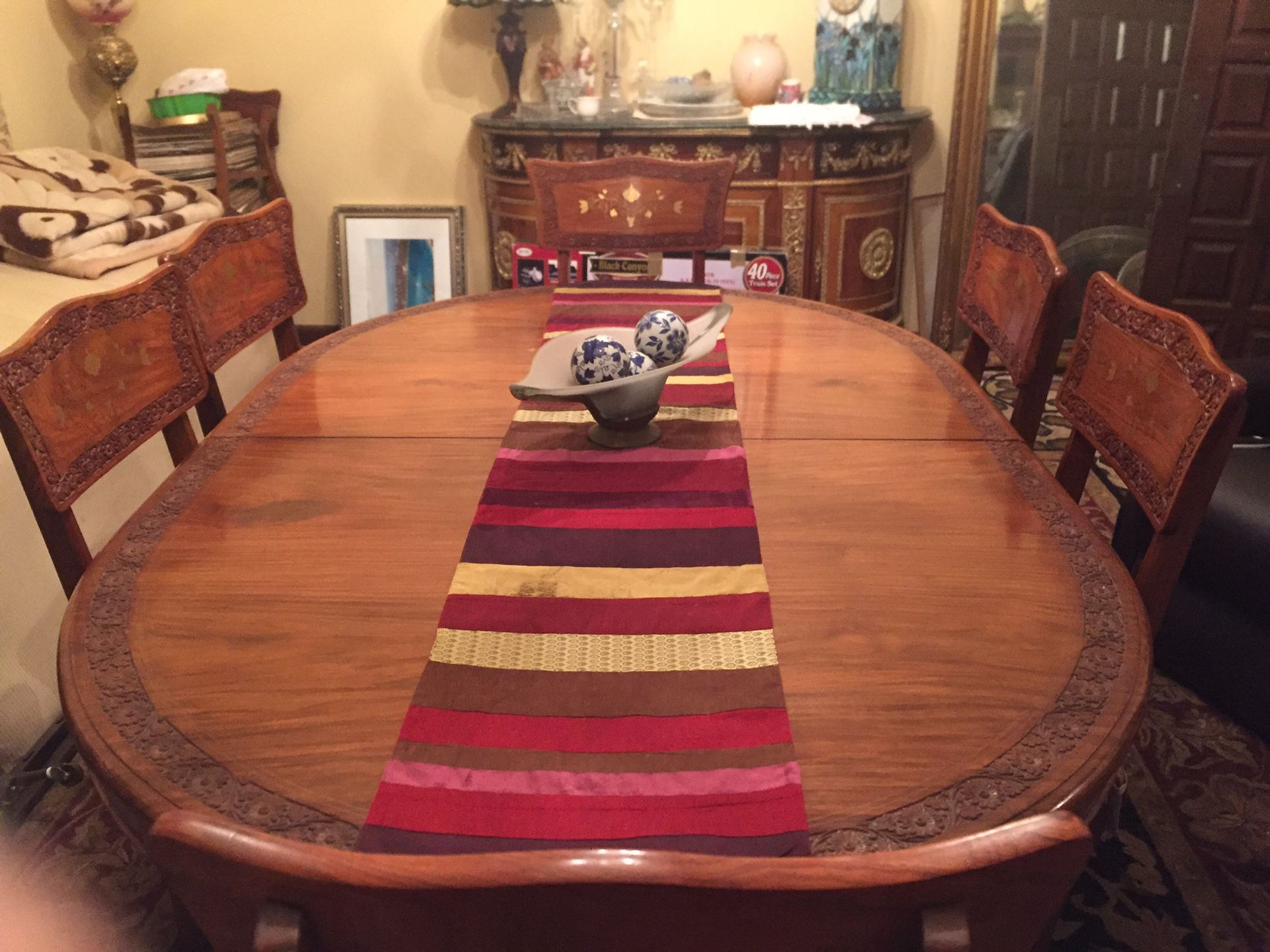 Antique gold inlaid dining table with 8 chairs...