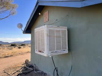 Window-Mounted Evaporative cooler “Swamp Cooler”