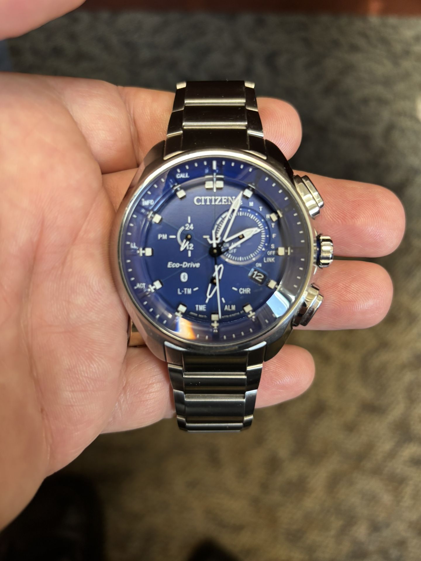 A 48 mm Blue Dial Citizen E Co-Drive Watch With Blue Tooth, Super Titanium Model BZ1040-50 With Silver Wrist Band Size 81/2 In Excellent Condition