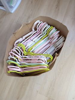 Dozens of baby clothes hangers