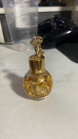 24k gold flakes in a 24k gold container