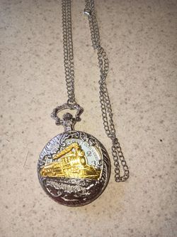 Silver and gold tone pocket watch