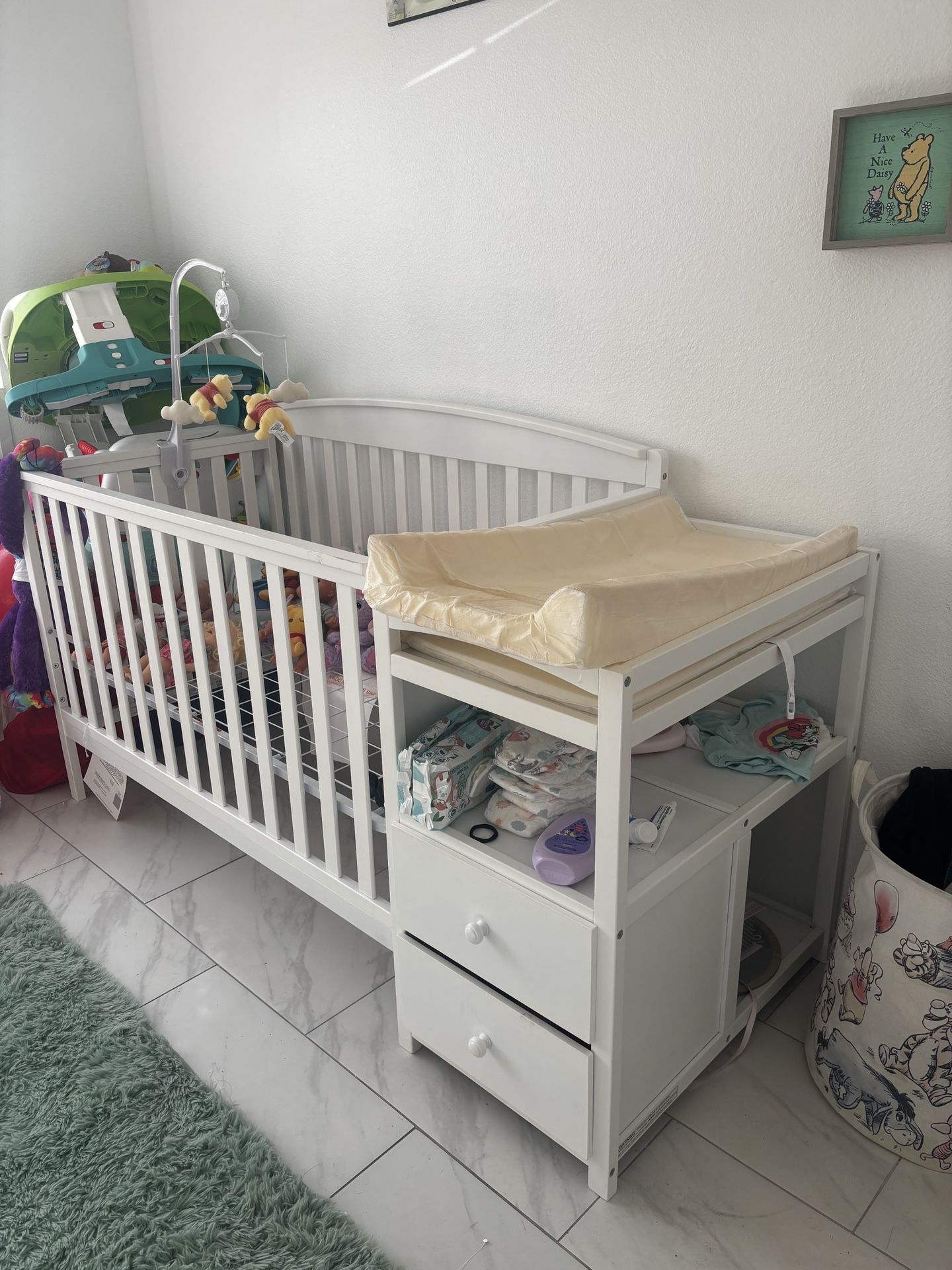 Crib with attached changing table