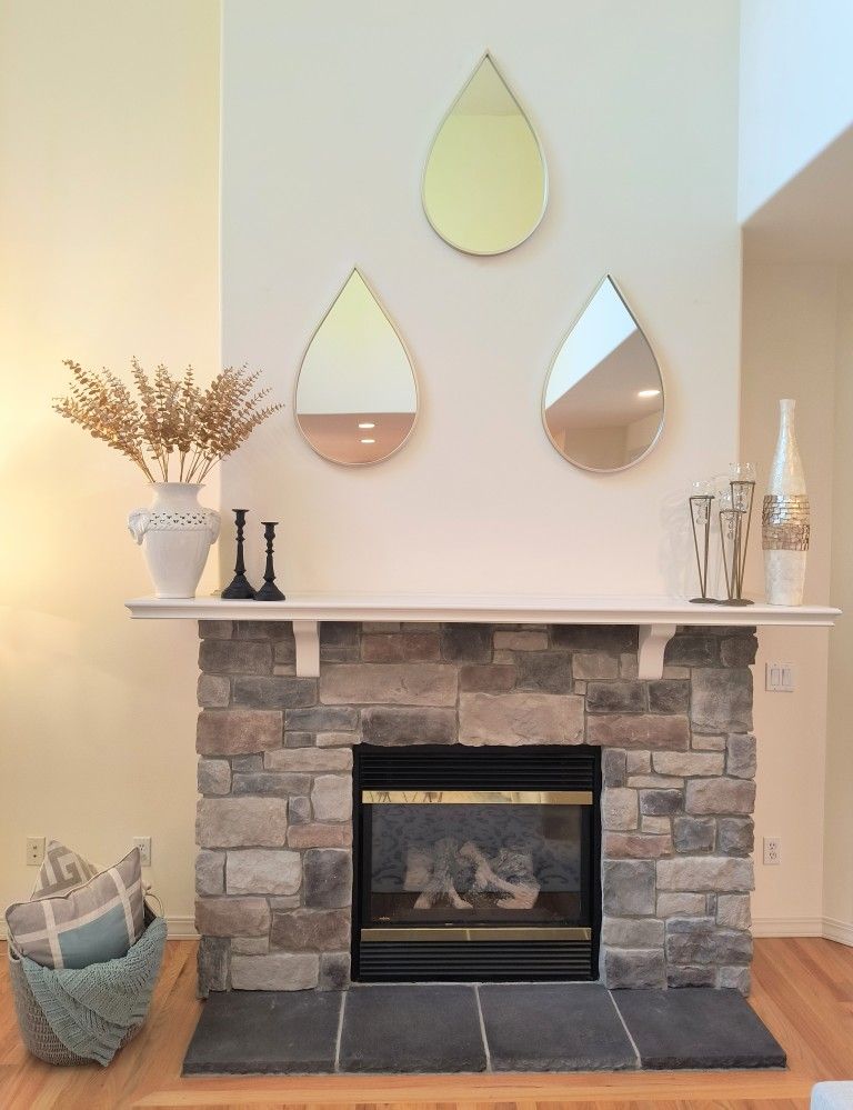Mantle & fireplace decor:3 Large Gold wall mirror teardrops, 2 white & gold vases, gold Eucalyptus, 2 black candle holders & More