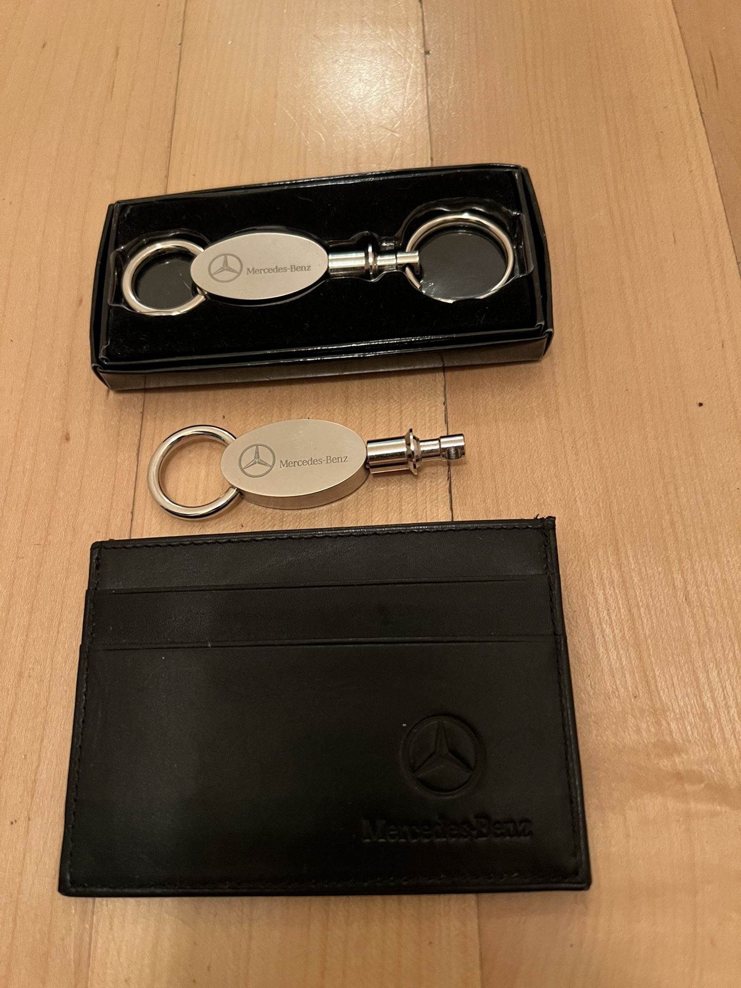 2—- MERCEDES KEY CHAINS AND ONE MERCEDES Credit Card Holder