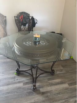 large glass table with 3 chairs