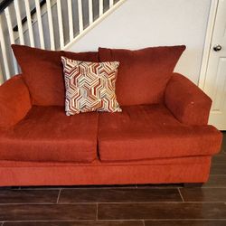 Red Couches With Pillows