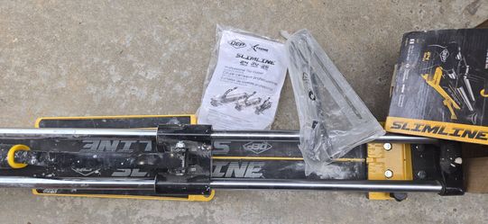 Manual tile cutter.