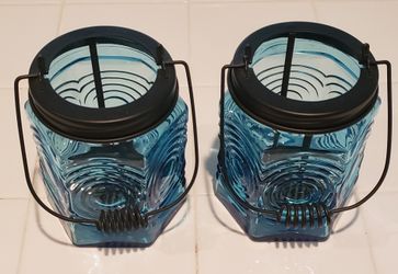Two (2) glass candle holders