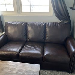 Dark brown learher pull out couch