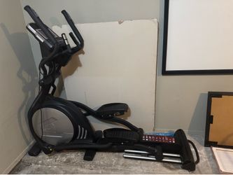 Sole E35 elliptical machine with a front-mounted flywheel.
