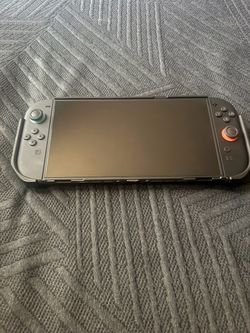 Nintendo Switch with Joy-Con Controllers, protective case and screen protector.