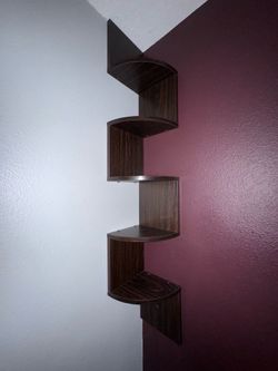 5-tier zig-zag floating corner shelf in a dark espresso/walnut finish