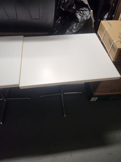 2 White Restaurant Tables 24" By 30" Each Of Them