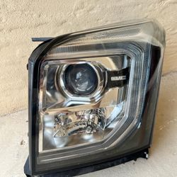 Pre-Owned GMC Yukon Left Headlight In Good Working Condition