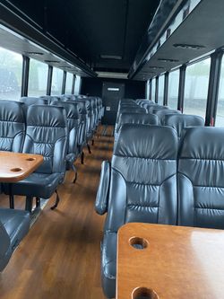 (Bus seats) Black leather seats with tables good for all kind of projects
