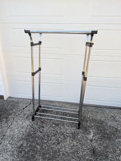 Double clothing rack. This is the tallest setting it can go half as tall also. Strong and holds a lot of clothing