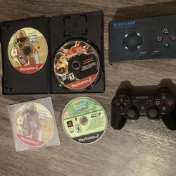 4 Ps2 games 2 controllers 