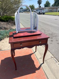 white-framed, arched, tri-fold mirrors vanity console table drawer